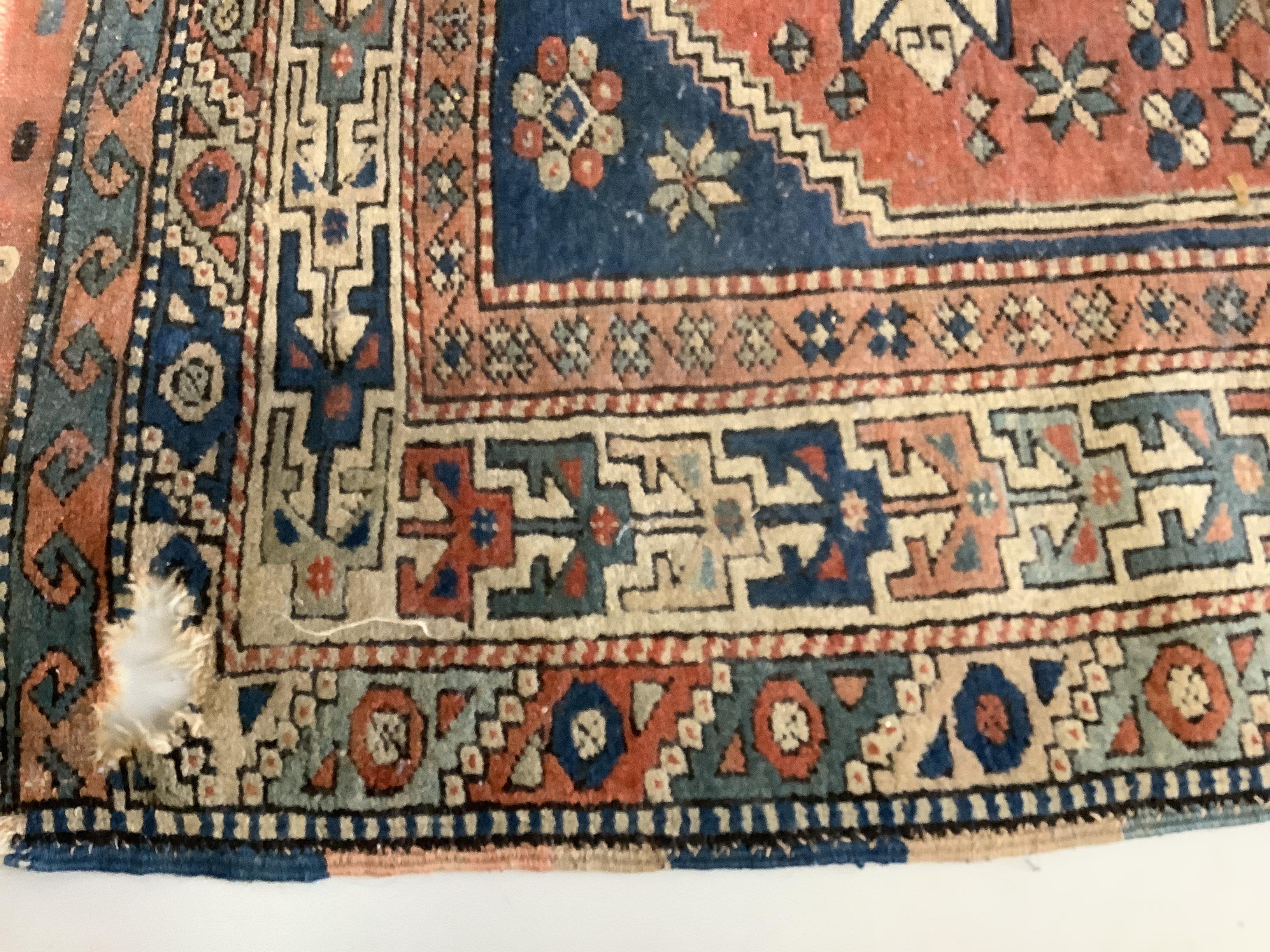 A Caucasian blue ground rug, 150 x 106cm